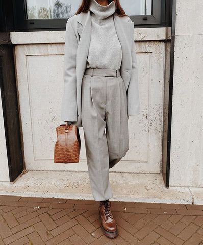 woman in grey coat, pants, and sweater for gray outfits