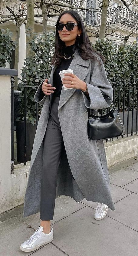woman wearing black top, grey coat, and pants for her gray outfits