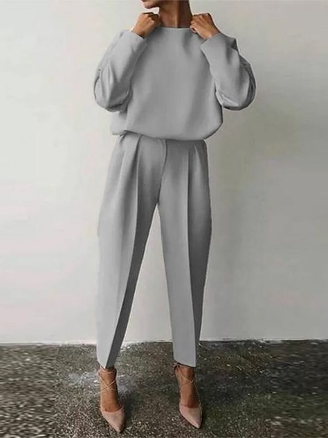 woman in grey top and pants