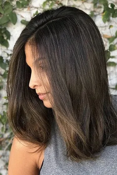 Straight Mid Length hairstyle with soft layers