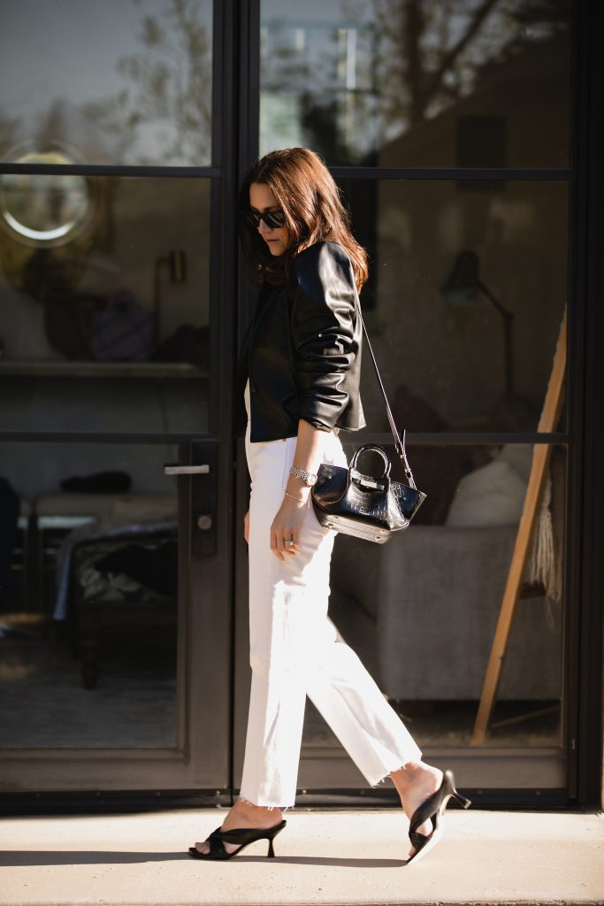 white jeans and black leather jacket outfit idea