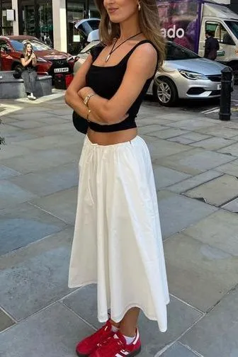 white skirt and sneakers outfit idea