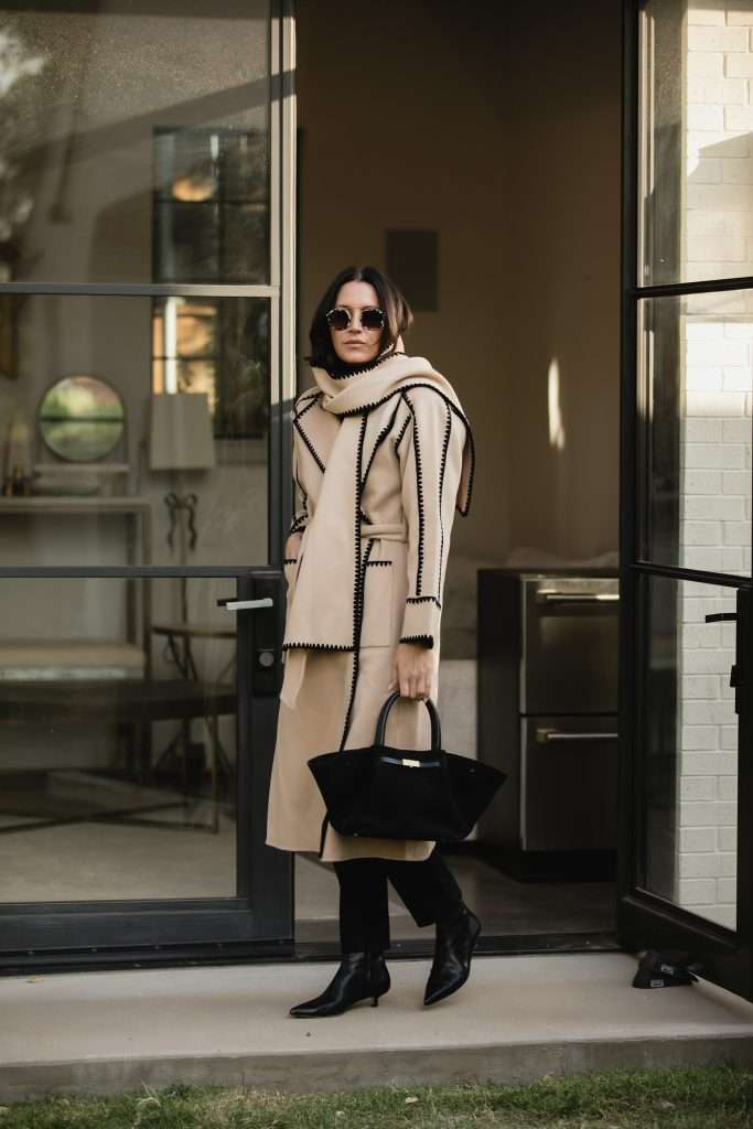 camel coat and heeled boots outfit idea