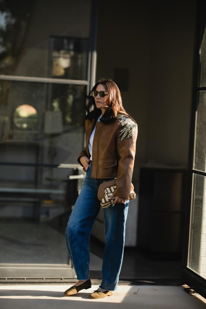 Concert T-Shirt with a Leather or Denim Jacket and Jeans